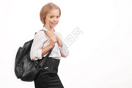 穿着校服 带着背包的微笑女学生肖像图片