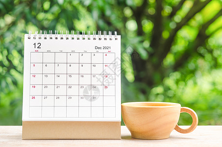2021年12月 组织者日历台 在木制桌子上规划和提醒规划师数字空白绿色假期季节会议办公室商业日记图片