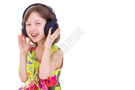 一个带耳机的小女孩 听音乐电脑器具技术设备微笑青春期数字手机青少年白色图片
