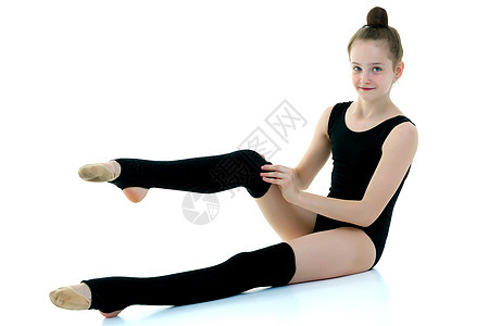 女孩体操运动员 在黑色的腿 运动的概念孩子童年身体快乐瑜伽女士地面平衡女性健身房图片