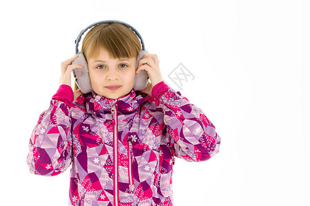 一个带耳机的小女孩 听音乐机动性青少年线索跳舞情绪化女孩童年技术白色工具图片