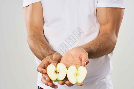 情绪化的大胡子男人手里拿着苹果水果零食食物黑发快乐白色微笑漫画幸福饮食成人绿色图片