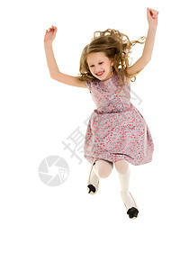 美丽的金发美女快乐地与举起手跳跃跳跃孩子们幸福头发裙子舞蹈微笑乐趣工作室喜悦图片