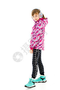 一个带耳机的小女孩 听音乐手机跳舞微笑电子产品年龄女孩电子白色技术音乐图片
