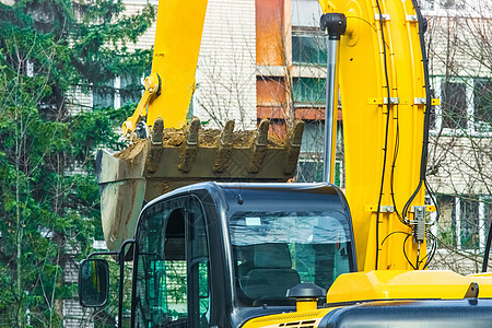 城市的挖掘工作 街道上的建筑或工业设备挖土 在地上挖土起重机地球地面机器公寓房子工程技术活动机械图片