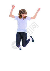 一个十几岁的女孩在跳跃活力裙子白色快乐运动飞跃微笑童年工作室幸福图片