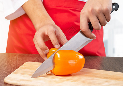 切橙色鲜胡椒厨房餐饮菜单营养木板职业男性餐厅围裙蔬菜图片
