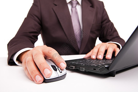 手头上的计算机鼠标白纸电脑商务人士成人笔记本套装桌子工作领带夹克工人老鼠男人图片