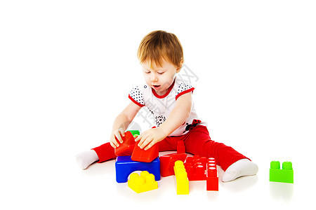 女婴在玩教育玩具游戏活动女孩逻辑建造积木创造力塑料工作室学习孩子图片