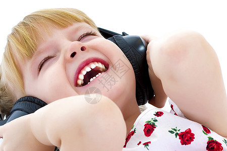 一个带耳机的小女孩 听音乐女孩音乐电脑跳舞电子工具手机青少年情绪化小学图片