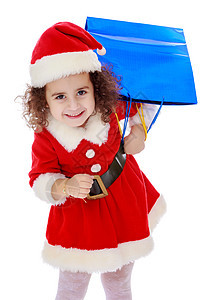 穿着圣诞老人装扮的小女孩 带着色彩多彩的包裹童年季节微笑盒子乐趣展示庆典婴儿假期孩子图片