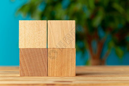 桌边木质区块 植物背景模糊立方体拼写商业团体桌子积木图片