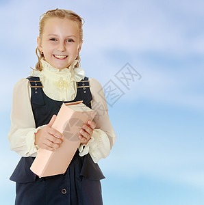 女孩学校穿着黑色的礼服 书在他的手中孩子眼镜瞳孔学生教育书包知识图书背包工作室图片