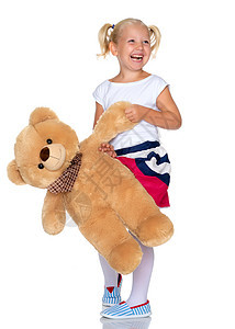 带泰迪熊的小女孩女儿乐趣喜悦青年女性快乐童年婴儿微笑玩具图片