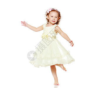 演播室里可爱的金发女孩微笑快乐裙子女性乐趣白色幸福活力飞跃运动图片