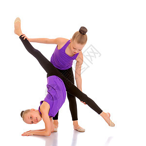 女体操运动员进行锻炼力量平衡身体女士女性芭蕾舞体操缠绕有氧运动活动图片