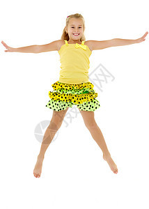 小女孩跳起来了快乐工作室乐趣白色运动裙子飞跃微笑喜悦活力图片