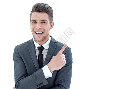 年轻英俊的生意人 笑得满脸微笑 指着Fing幸福套装手臂领带手指男人销售快乐商业经理图片