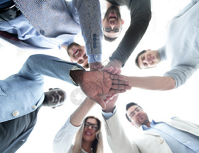 生意团队把双手折叠在一起了合伙圆圈组织同事工作会议商业合作蓝图手势图片