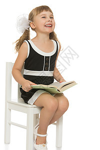 带着一本书的小女孩阅读童年女性学习快乐白色孩子们幼儿园学校教育图片