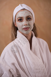 施用面罩的斯帕妇女女士面具治疗奶油微笑护理卫生保健毛巾身体图片