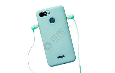 配有保护和耳机的数码电话 放在桌子上屏幕技术互联网小样案件配饰工具蓝色商业机动性图片