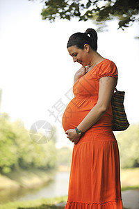 怀孕期女士女孩裙子喜悦妈妈婴儿母亲姿势女性娱乐图片