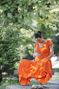 怀孕期母性喜悦女士女孩保健卫生女性橙子姿势公园图片
