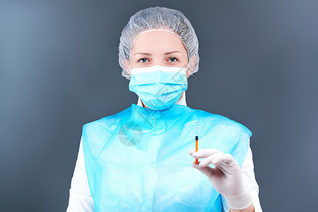 身穿防护服和面罩的护士保护自己免受病毒感染女性手套剂量诊所注射临床工作治疗疾病疫苗图片