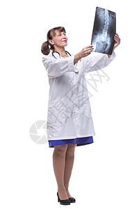 穿着检查X光的实验室大衣和听诊器的有吸引力的女性护士或医生诊所办公室工作学生专家疾病x射线技术女士药品图片