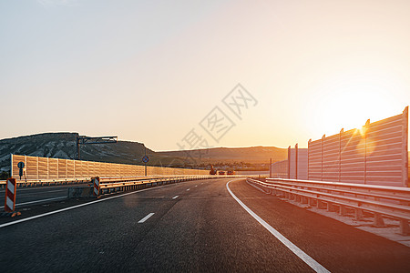 黎明时空高速公路 从司机的角度看国家日落阳光天空视角场景沥青日出运输旅行图片