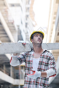 建筑工地的硬体工人承包商头盔白色建筑师员工劳动黄色微笑商业成人图片