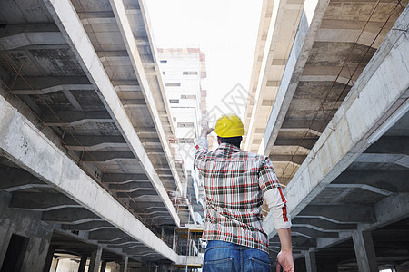 红白格子建筑工地的硬体工人男人成人安全帽建筑师工程师安全领班修理工工作建设者背景