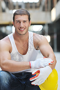 建筑工地的硬体工人建设者工业手势修理工安全帽建筑师黄色承包商微笑安全图片