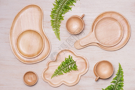 桌面上的各种厨房用具的模型设计概念 其设计方式如下工具桌子烘烤木头厨具食物刀具烹饪勺子餐具图片
