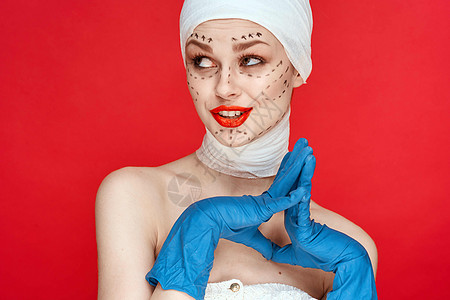 红嘴唇整容手术 脱下肩膀 红底背面医生药品身体治疗程序成人病人诊所女士塑料图片