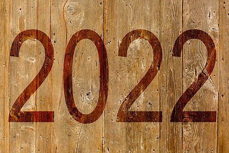 2022年以历史背景写作数字风景太阳天空庆典木头倒数日历爬坡草地背景图片