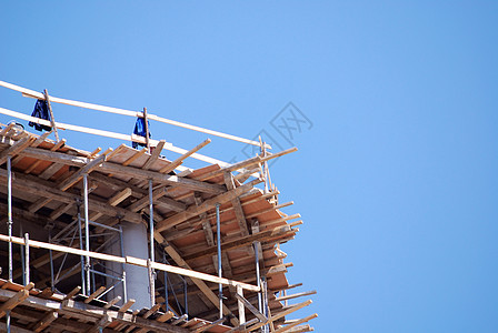 建筑工地机器工厂建筑工人焊接力量天空劳动力水泥工作起重机图片