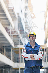 建筑工地的硬体工人承包商工程师公司黄色劳动者头盔帽子建筑学安全帽工业图片