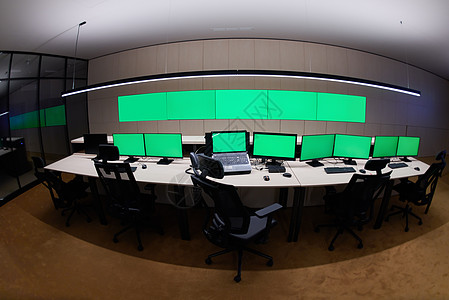 大型现代安全系统控制室的空置室内 有空白绿屏屏幕监视服务机构房间商业工作站视频控制电话中心图片