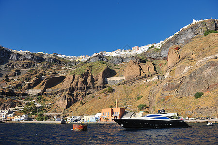 桑托里尼岛海岸配有豪华游艇快艇水手天空火山海滩旅行金融海洋帆船蓝色图片