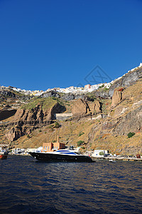 桑托里尼岛海岸配有豪华游艇金融支撑奢华海洋钓鱼旅游乘客旅行火山海岸线图片