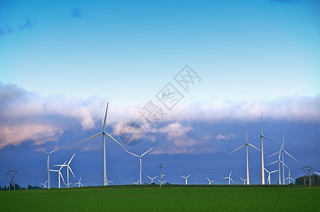 替代能源景观 - 位于明尼苏达州德克斯特附近的明尼苏达割草机县的风力涡轮机农场 日落时的风力涡轮机图片