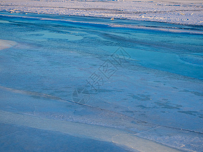 冰冻河冰层厚固的裂缝网络网水晶玻璃液体裂痕雪花地面冰川冻结天气蓝色图片