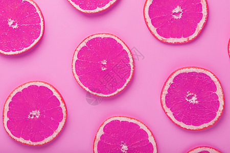 切格瓦拉葡萄果切片在粉红色背景上 以图案形式呈现模式圆圈热带果汁艺术食物团体饮食橙子水果背景