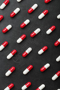 黑背景的红色和白色药丸胶囊模式 笑声插图治疗化学品药物帮助药店医生卫生制药药剂图片