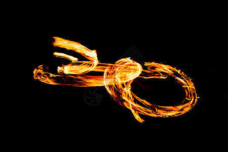 火光耀眼的火焰运动 夜间性能摘要绘制舞蹈橙子马戏团男人戒指文化风险小径节日涡流图片