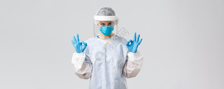 Covid19 预防病毒 健康 医护人员和检疫概念 自信的医生或护士在防护设备 PPE 呼吸器 医用手套中表现出良好的姿态女性病图片