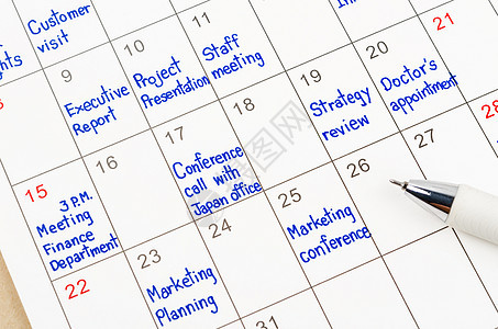 用笔在日历单上手写预约时间表奶制品职场工作商业日记床单会议互联网技术规划师图片
