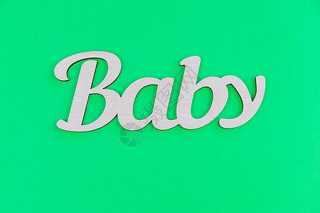 秋分字在绿色背景下给婴儿写字女孩身份新生娘娘腔童年父母婴儿期怀孕字母分娩背景